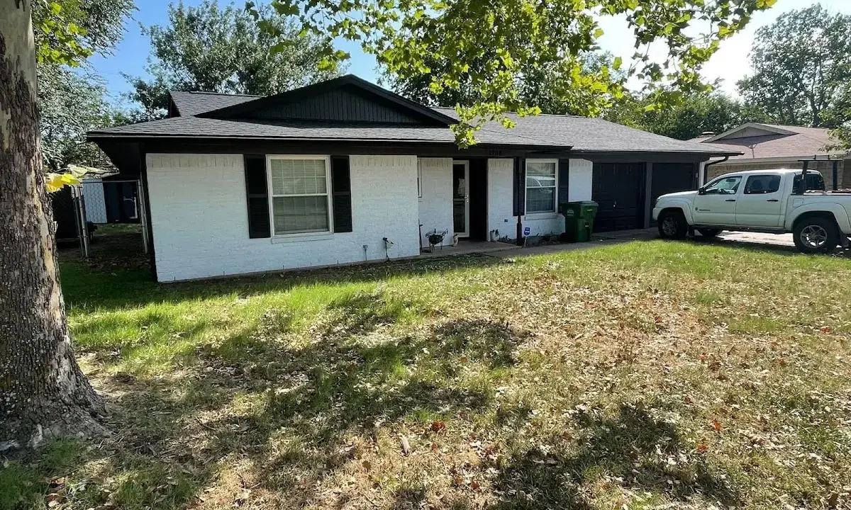 Professional roofing crew working on a residential roof in Obetz